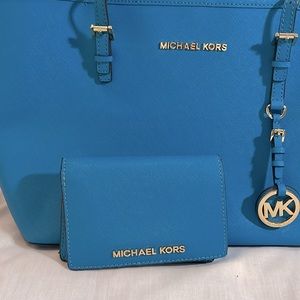 Bright blue Micheal Kors shoulder bag with matching wallet